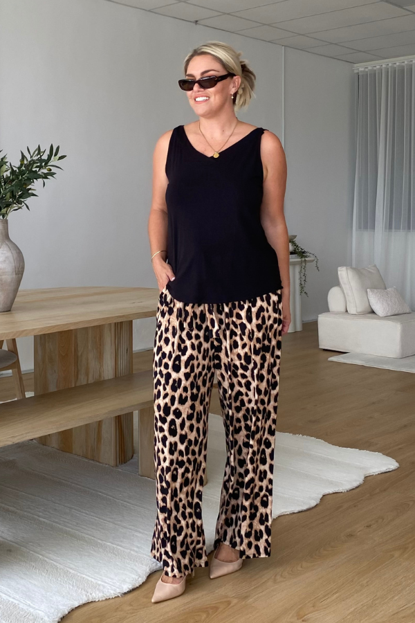 Luna Bamboo Sleeveless Top in Black showing curved hemline and relaxed fit.