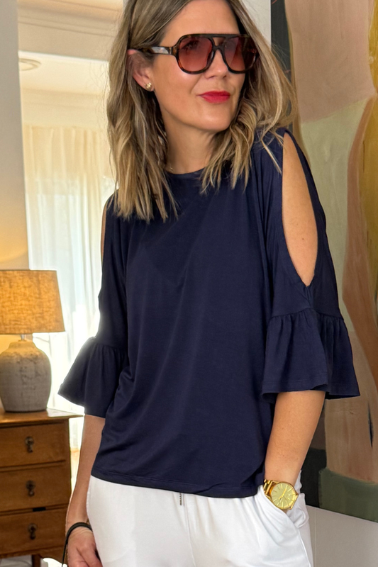 Natali The Label Sofia Top in navy bamboo fabric—relaxed fit with round neckline, cold shoulder cutouts, and feminine frill sleeves for breathable day-to-night comfort.