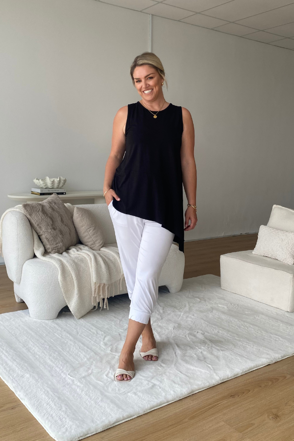 Model wearing Cora Bamboo 7/8 Slouch Jogger Pant in white – front view