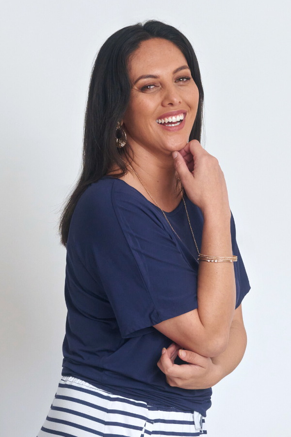 Side view of Chloe Bamboo Top in navy showing draped silhouette